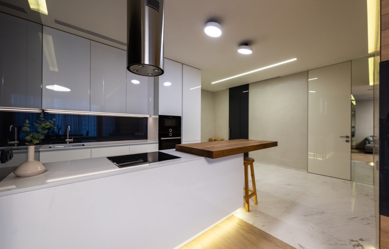Elegant cove lighting under cabinets & kitchen island - Beautiful Homes