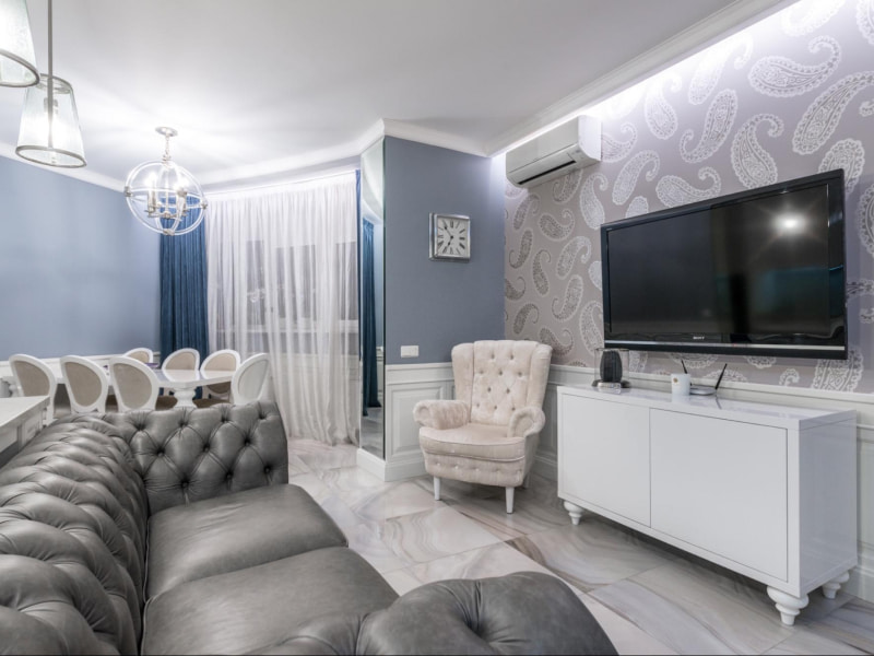 Painted shapes accent wall for the luxurious living room - Beautiful Homes