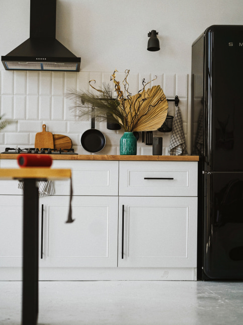 Use the empty space above the refrigerator for kitchen storage purposes - Beautiful Homes