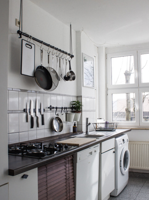 Store kitchen accessories above the kitchen sink - Beautiful Homes
