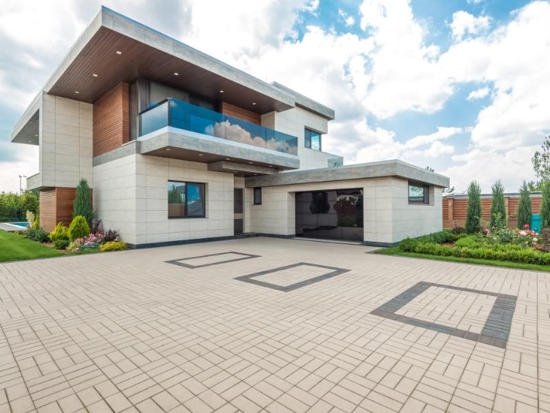 Courtyard tiles design with garden surrounding the house - Beautiful Homes