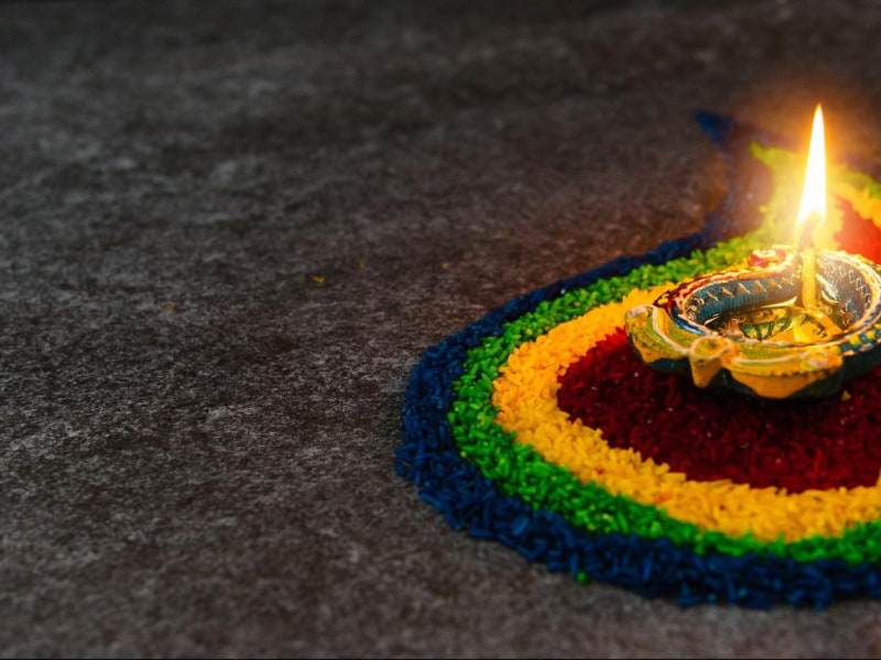 Diwali deepak with rangoli décor - Beautiful Homes