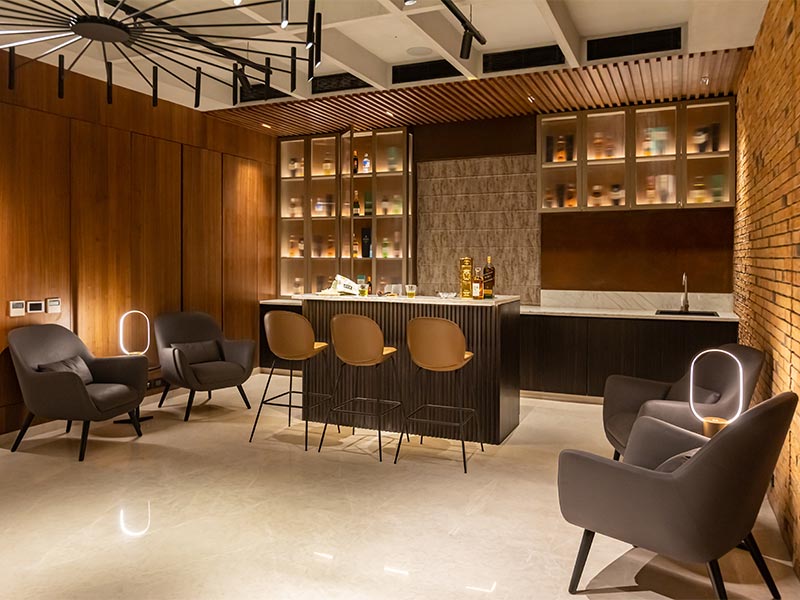 Home bar designs with island counter & wall panelling - Beautiful Homes