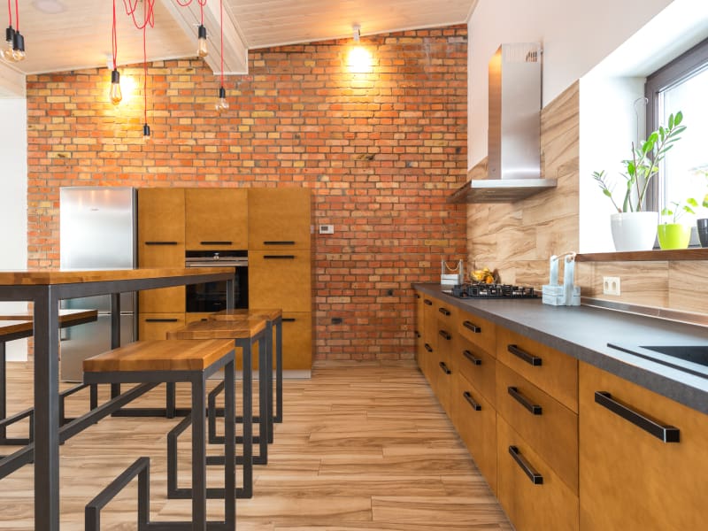 Simple kitchen false ceiling with brick wall paneling - Beautiful Homes