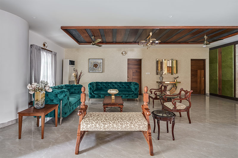 Wooden PVC ceiling panels with a chic chandelier in this classy living room - Beautiful Homes