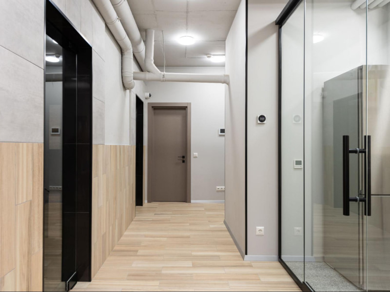 Wooden tiles design for front wall in the foyer interiors - Beautiful Homes