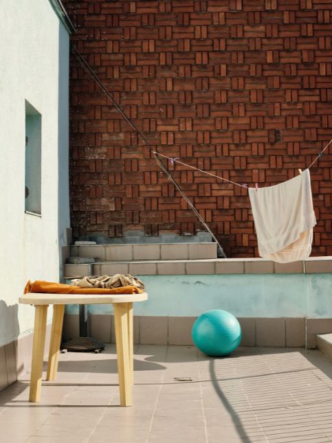 Laundry room in balcony with cabinets - Beautiful Homes