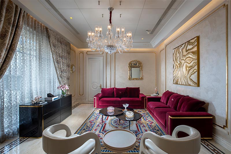 Cream wall design with magenta colour for sofa - Beautiful Homes