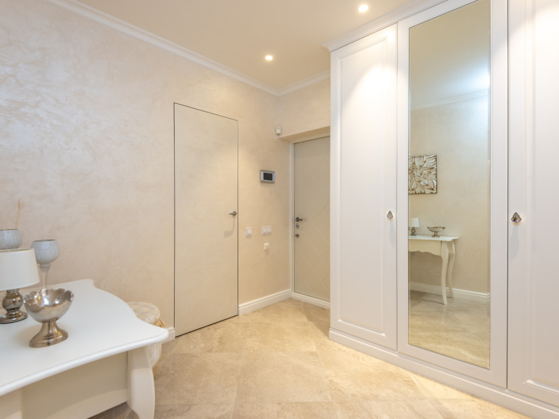 White wardrobe with a mirror to enhance your home - Beautiful Homes