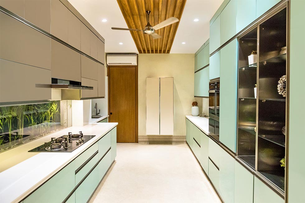Sleek parallel kitchen design with colourful interiors - Beautiful Homes