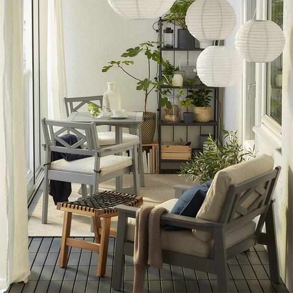 Balcony furniture idea with lounge chair & a seating nook - Beautiful Homes