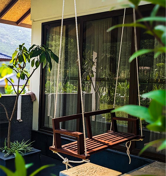 Balcony swing for a traditional balcony furniture idea - Beautiful Homes