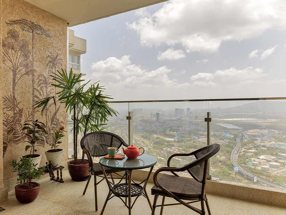 Glass & steel balcony grill design ideas - Beautiful Homes