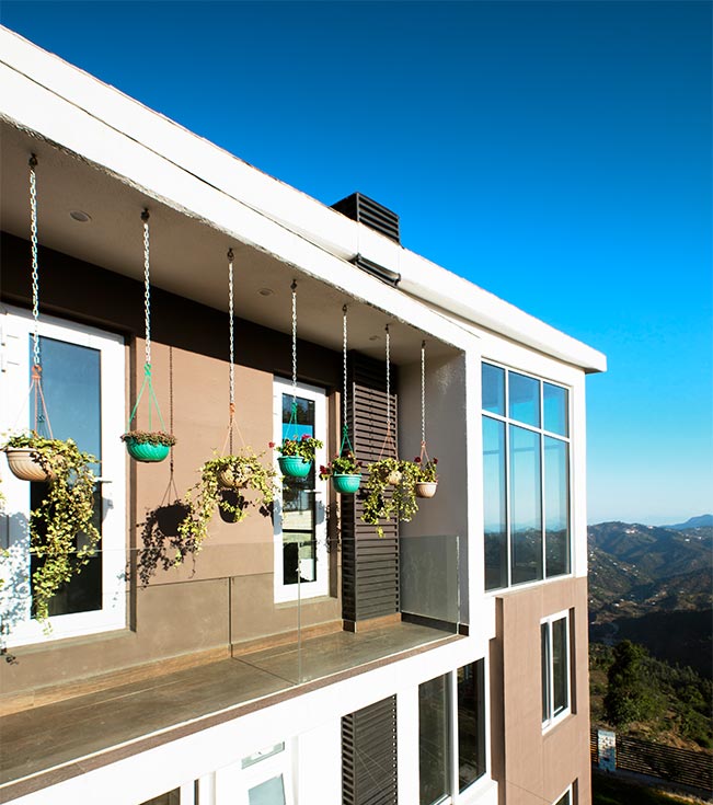 Minimalist glass cover modern balcony grill design - Beautiful Homes