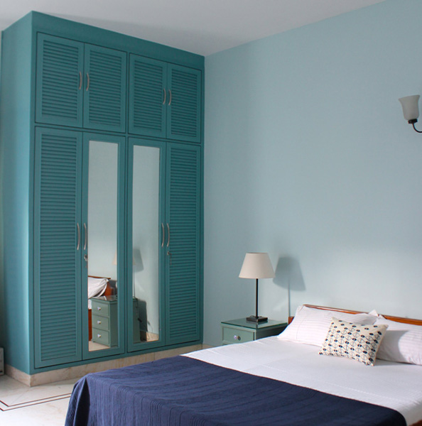 Blue wood-finish laminate wardrobe with mirrors – Beautiful Homes