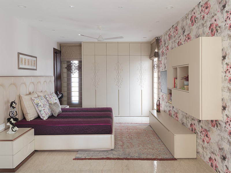 White laminated wardrobe with patterned wallpaper – Beautiful Homes