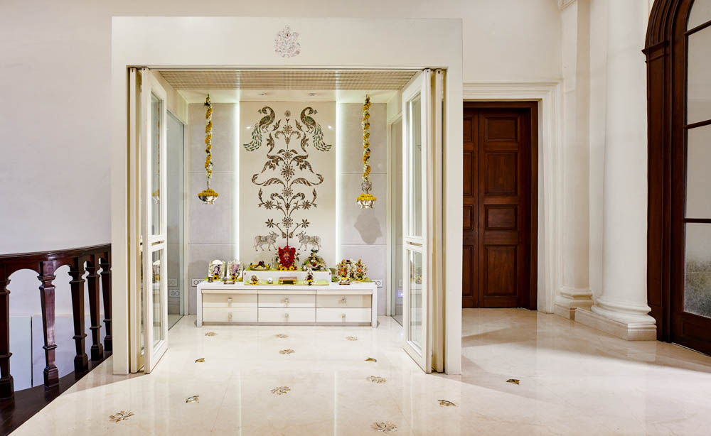 Temple design in the corner of the room fitted with glass doors - Beautiful Homes