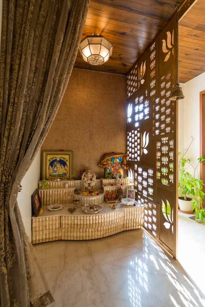 Home temple design with cut out patterns on room divider - Beautiful Homes