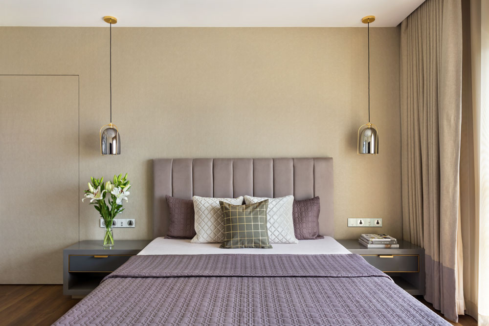 Simple bedroom interior design with designer pendant lights from the ceiling - Beautiful Homes