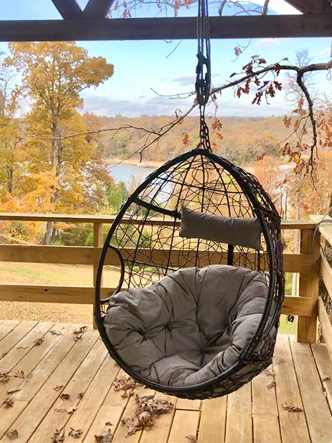 Single swing jhoola design for wooden front balcony - Beautiful Homes