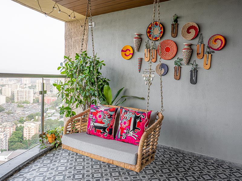 Swing chair for large balcony will wall decoration & patterned floors - Beautiful Homes