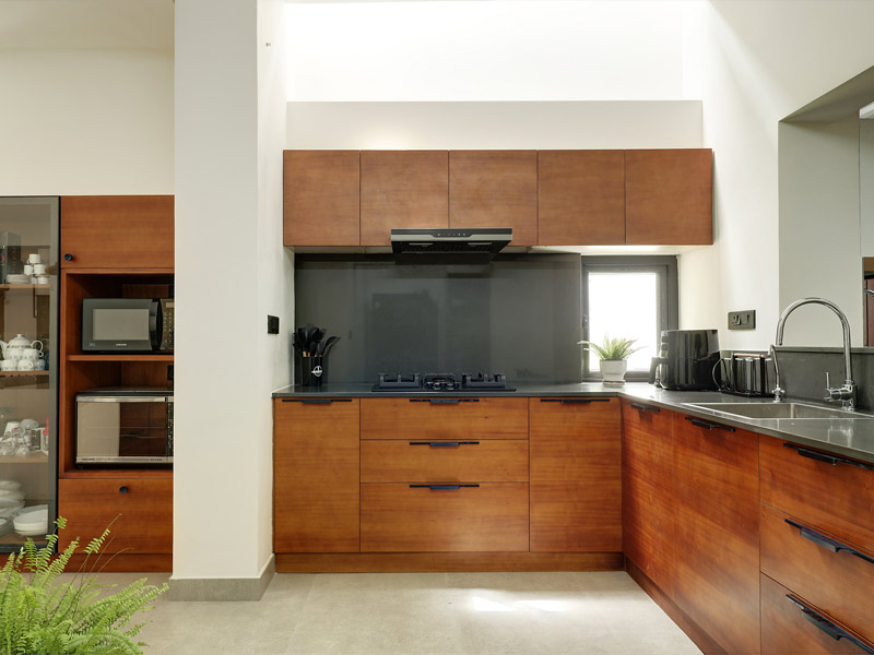 Wooden finish kitchen cabinets design for your kitchen interiors - Beautiful Homes