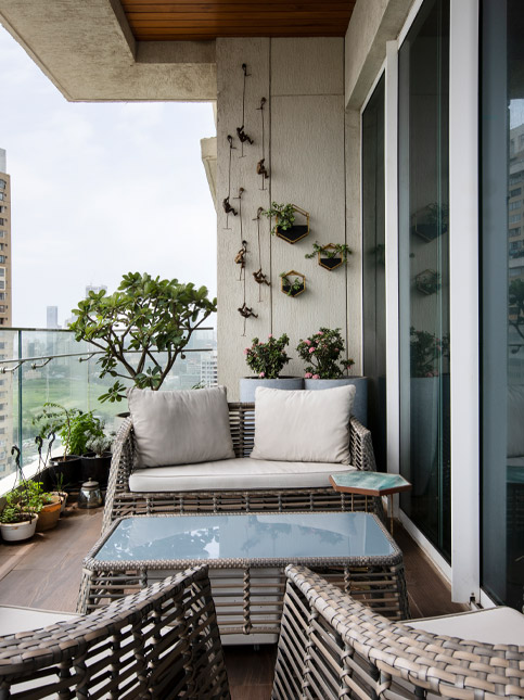 Small balcony furniture design with wooden flooring - Beautiful Homes