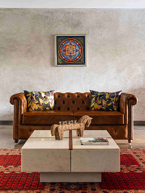 Tan Coloured Sofa With Leaf Print Pillows - Beautiful Homes