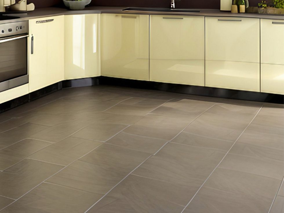 Yellow cabinets with grey flooring - Beautiful Homes