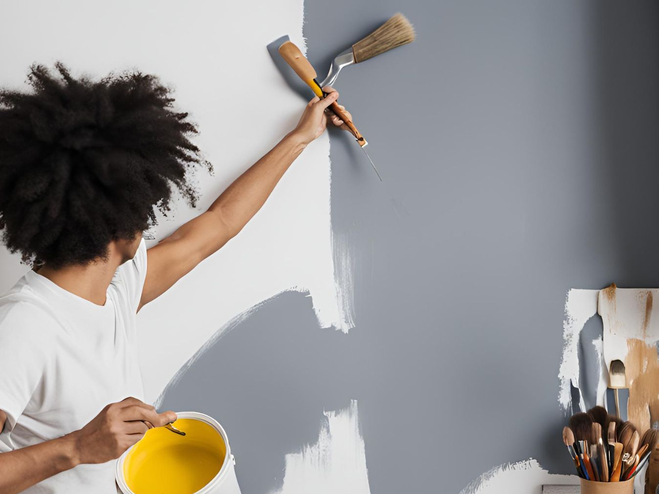 A person painting kitchen wall - Beautiful Homes