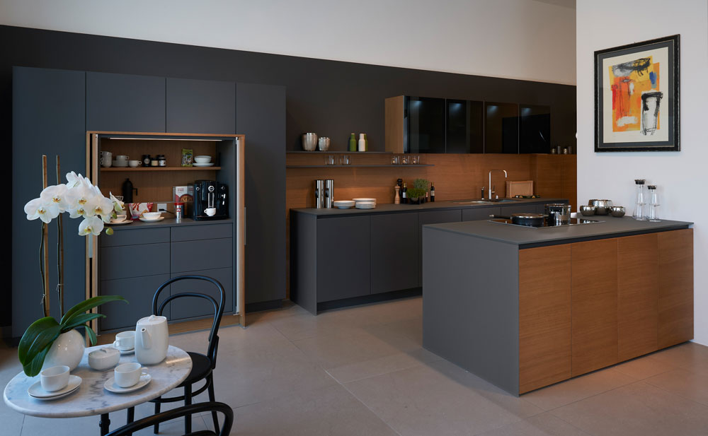 Seamless kitchen design with cabinets that cover every rack & a small breakfast nook - Beautiful Homes