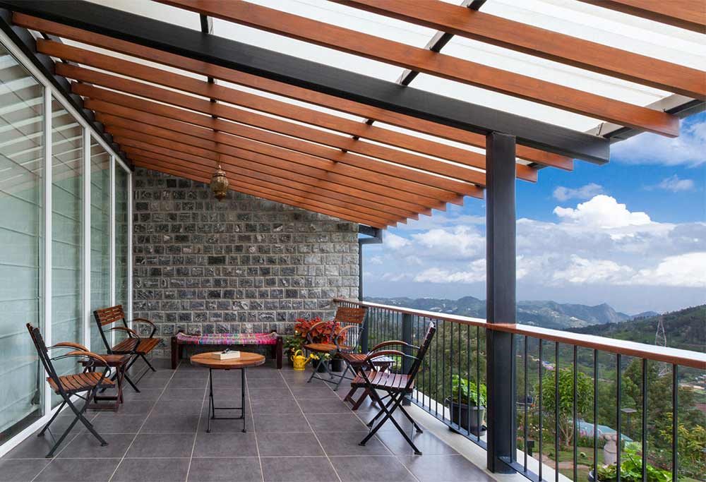 Modern balcony design with tile flooring & wooden chairs - Beautiful Homes