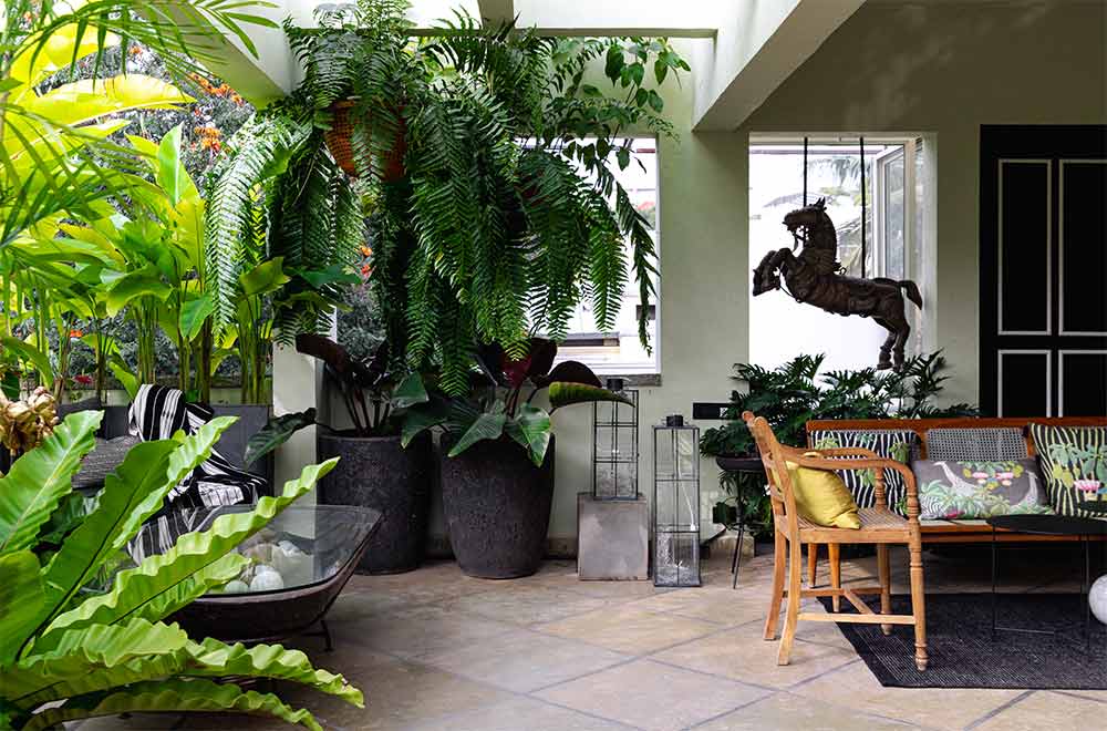 Simple modern balcony design with cane chairs - Beautiful Homes