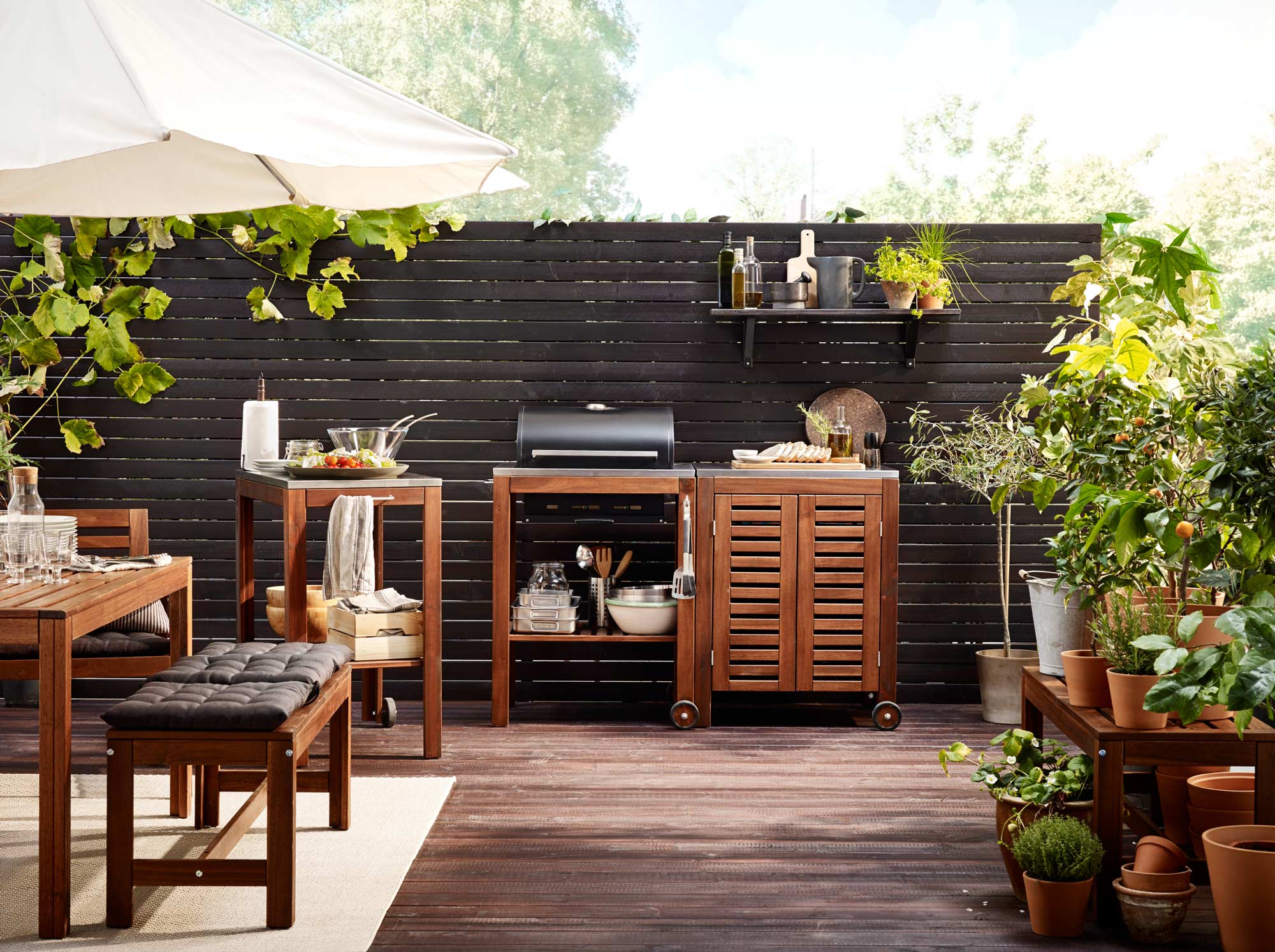 Simple terrace design with small grill station and small table - Beautiful Homes