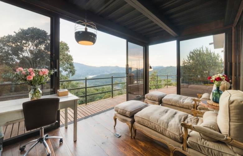 Apartment balcony décor with a study space & ottoman - Beautiful Homes