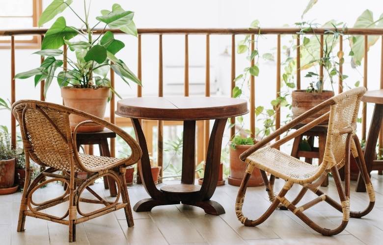 Balcony garden décor ideas with wooden table & chair - Beautiful Homes