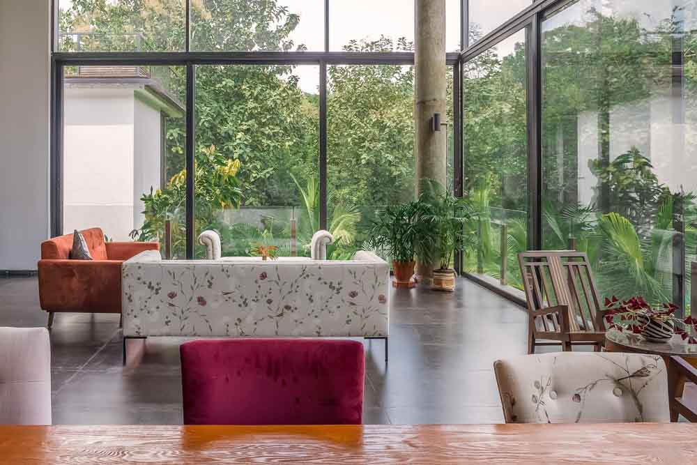 Open-plan living room that is dosed with a generous amount of daylight is great for natural flooring - Beautiful Homes