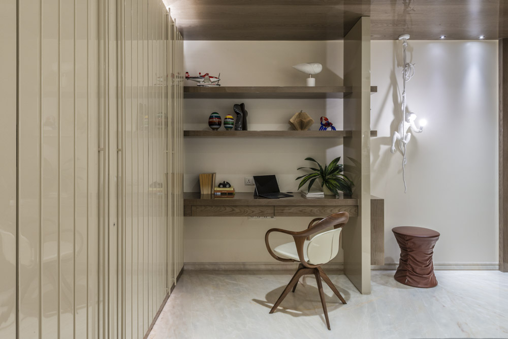 Minimal Home office setup on an open shelf with décor items - Beautiful Homes