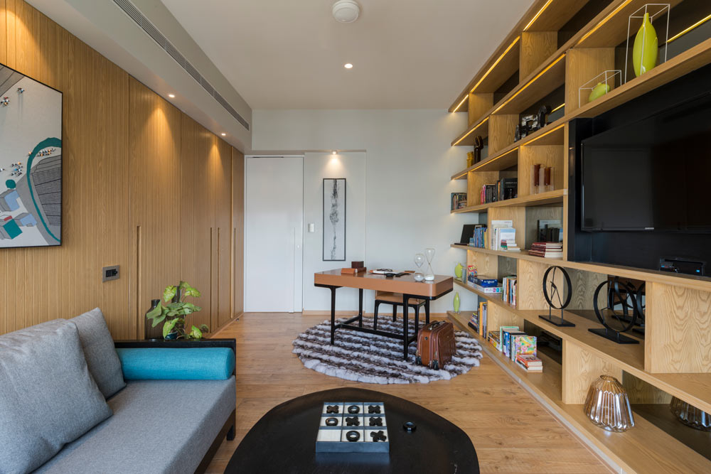 Open shelving system used as a backdrop for your home office setup - Beautiful Homes