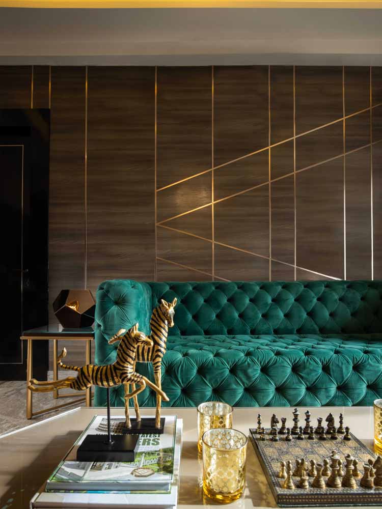 Modern home interior with velvet green sofa & gold home décor elements - Beautiful Homes