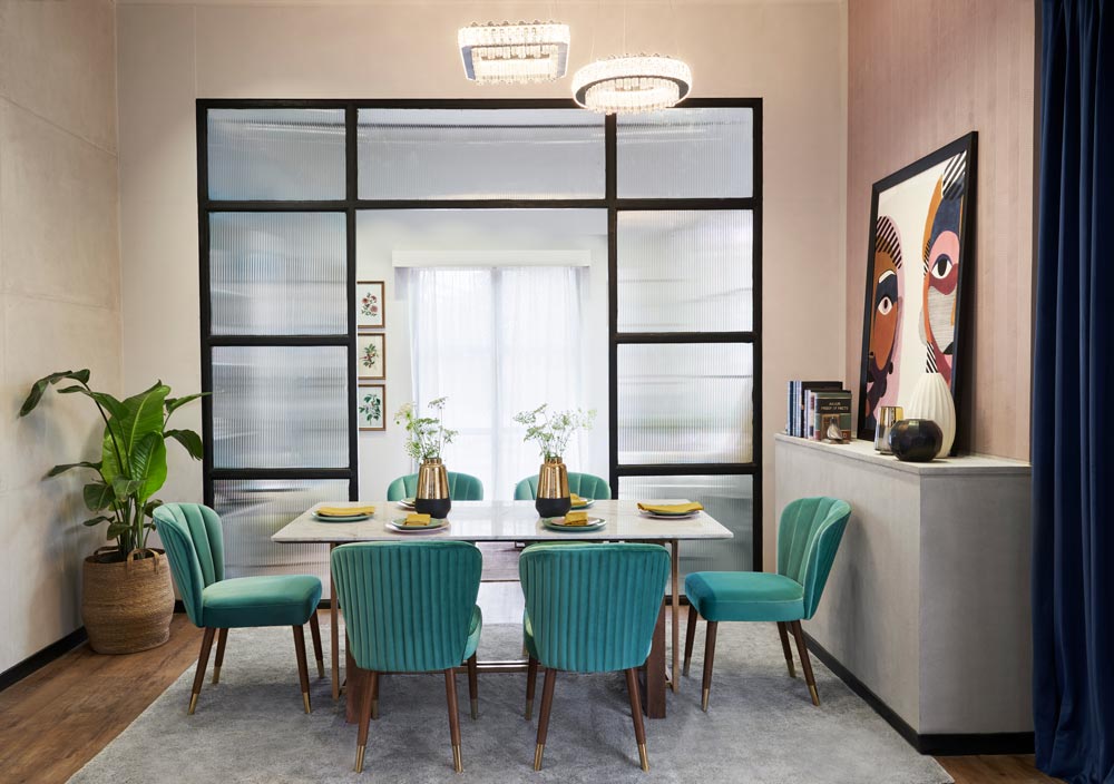 A cream dining room a six seater dining table with green chairs A cream dining room a six seater dining table with green chairs