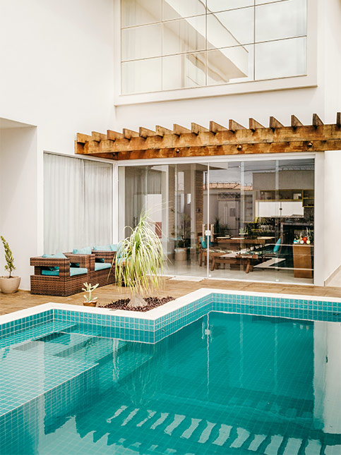 Use your home's verandah for making an indoor swimming pool for a functional home design - Beautiful Homes