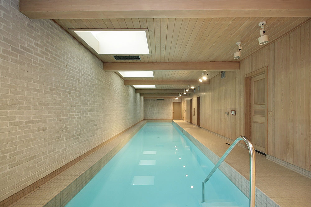 Contemporary swimming pool design in home interior for lap practices - Beautiful Homes