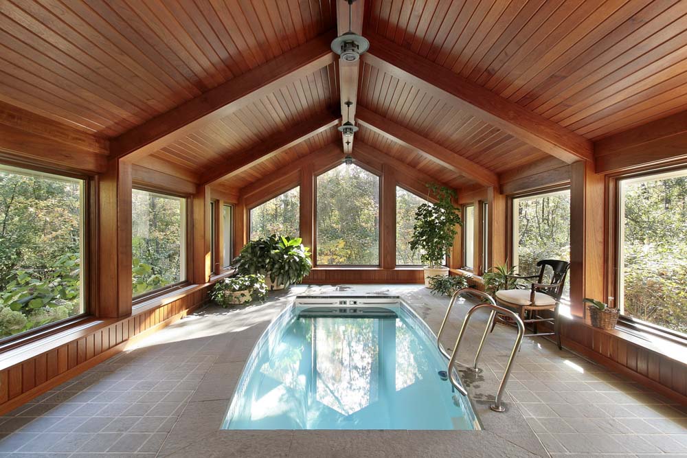 Beautiful tree house indoor swimming pool in a farm house design - Beautiful Homes