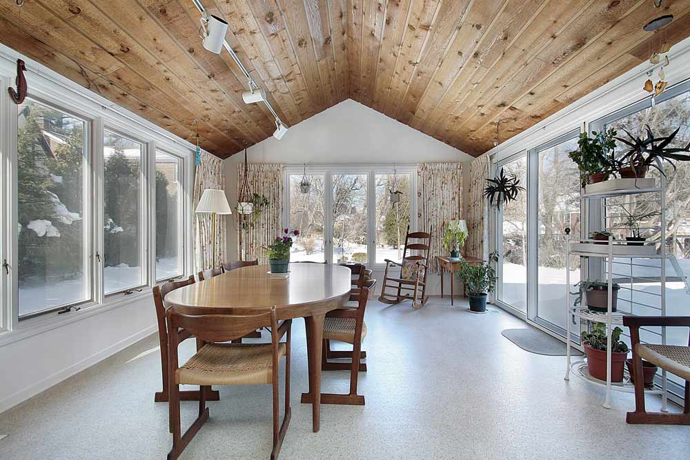 Light finish wood for ceiling design with light wood furniture for rustic effect in this dining room - Beautiful Homes
