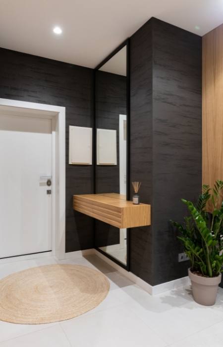 Entrance hall designs with full size mirror & round rug - Beautiful Homes