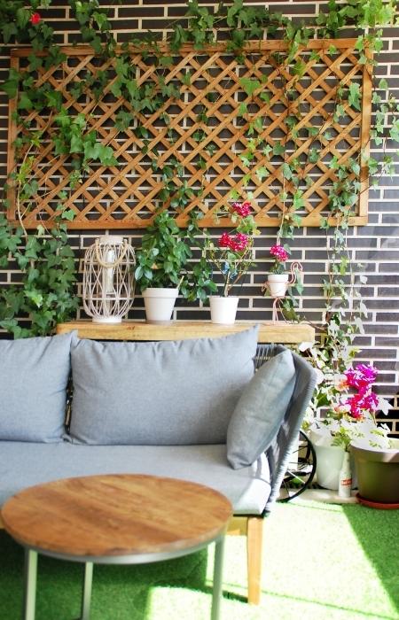 Artificial grass & Natural stone for your terrace garden flooring design - Beautiful Homes