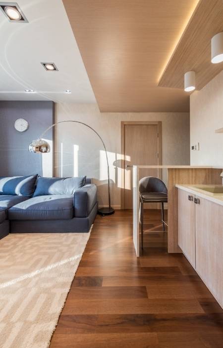 Studio apartment décor with wooden interiors & chic floor lamp - Beautiful Homes