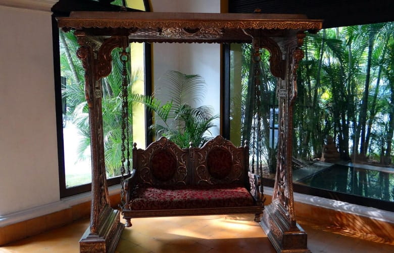 Traditional interiors with Indian jhoola design in the verandah - Beautiful Homes