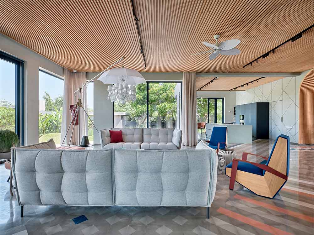 Drawing room ceiling with tufted sofa set - Beautiful Homes